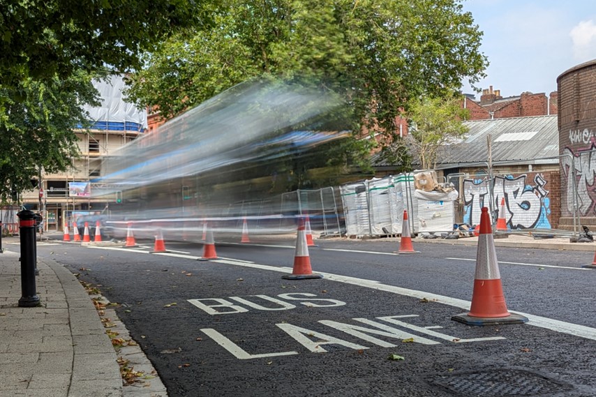 Bus travelling along Dalby Avenue with the new bus lane in the foreground